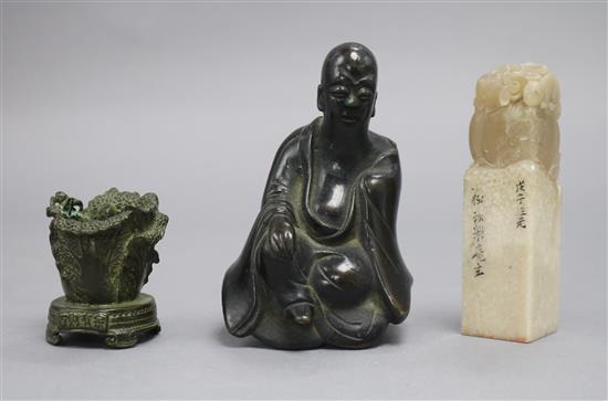 A modern soapstone seal, an 18th century Chinese bronze figure from a censer and a Chinese bronze of a napa cabbage and cricket tallest